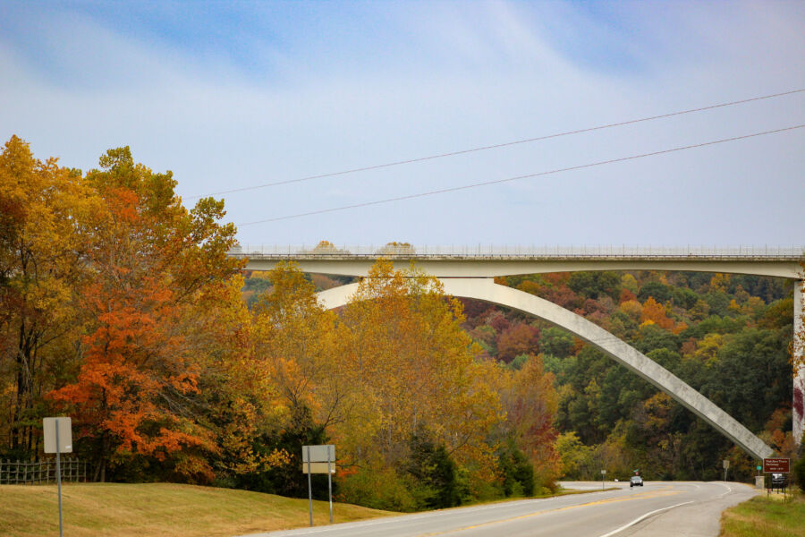 Scenic autumn view of the Natchez Trace Parkway with colorful trees and a bridge spanning the landscape