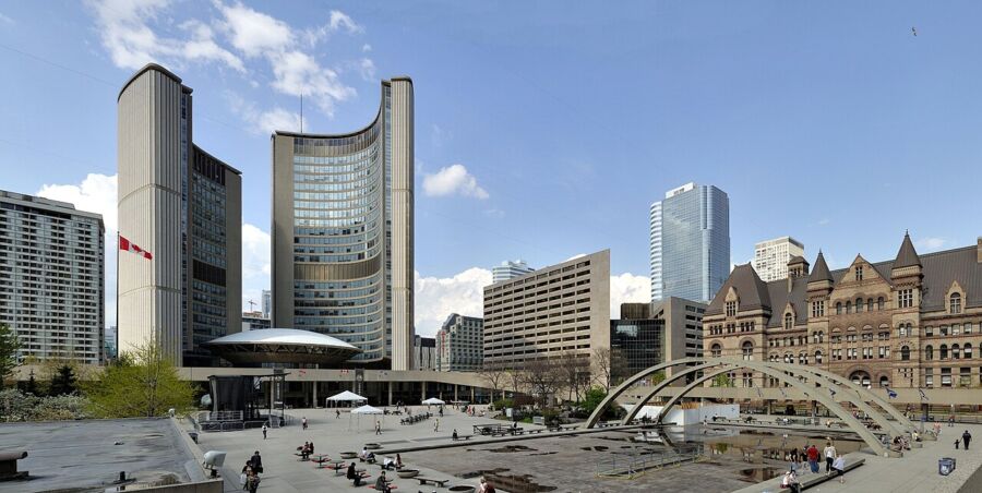 Nathan Phillips Square in Toronto, showcasing a spacious city square with a prominent fountain at its center.
