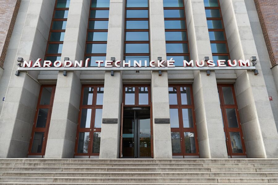Entrance of the National Technical Museum in Prague, featuring a modern facade and large glass doors