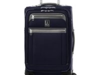 Navy soft-sided carry-on suitcase with spinner wheels and telescoping handle.