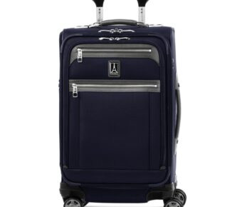 Navy soft-sided carry-on suitcase with spinner wheels and telescoping handle.