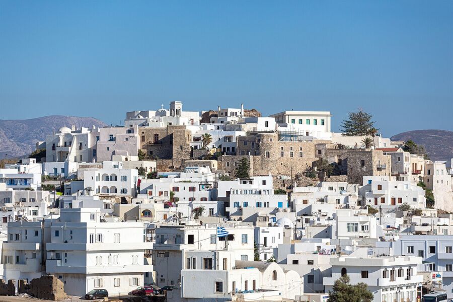 Scenic view of Mykonos, Greece, showcasing its iconic white buildings and vibrant blue sea.