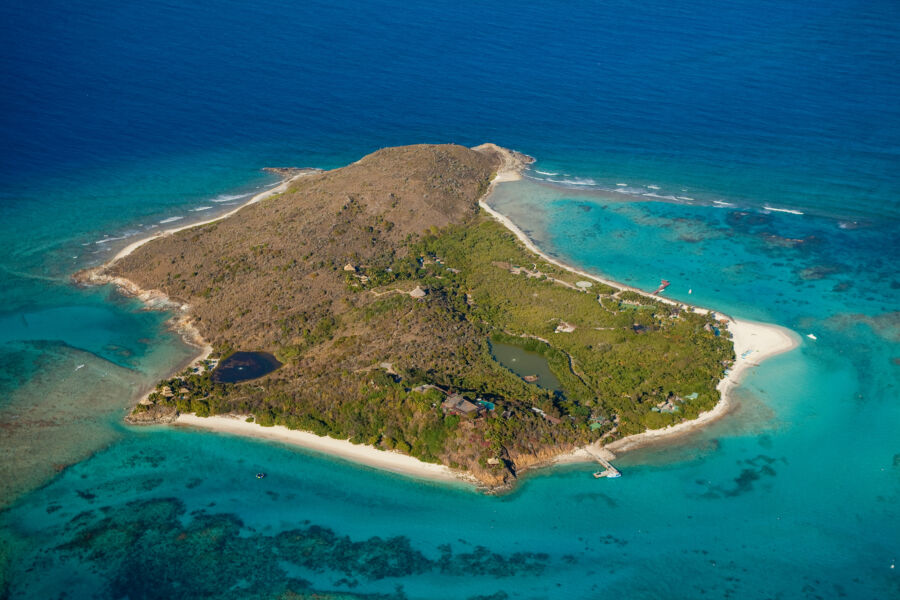Aerial view of Necker Island, showcasing its lush greenery and surrounding turquoise waters in the British Virgin Islands