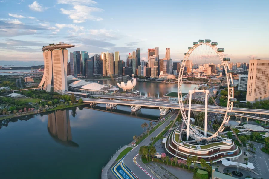 Modern Singapore skyline with skyscrapers and waterfront.