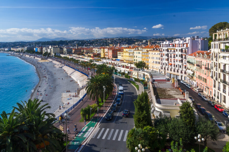Aerial view of Nice, France, showcasing a road with cars amidst the scenic landscape of the French Riviera