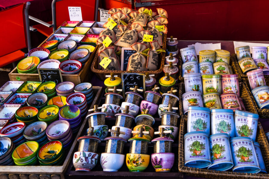 Charming Provencal souvenirs and gifts for sale at a bustling market stall in Corus Saleya, Nice, France