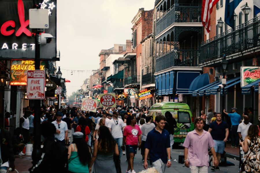Bourbon Street nightlife: vibrant, historic New Orleans scene with diverse crowd and festive atmosphere.