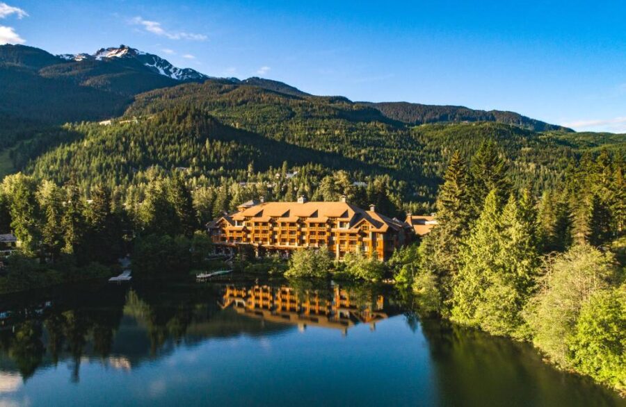 Nita Lake Lodge at Whistler Mountain Resort, surrounded by lush trees and mountains in Whistler, British Columbia.