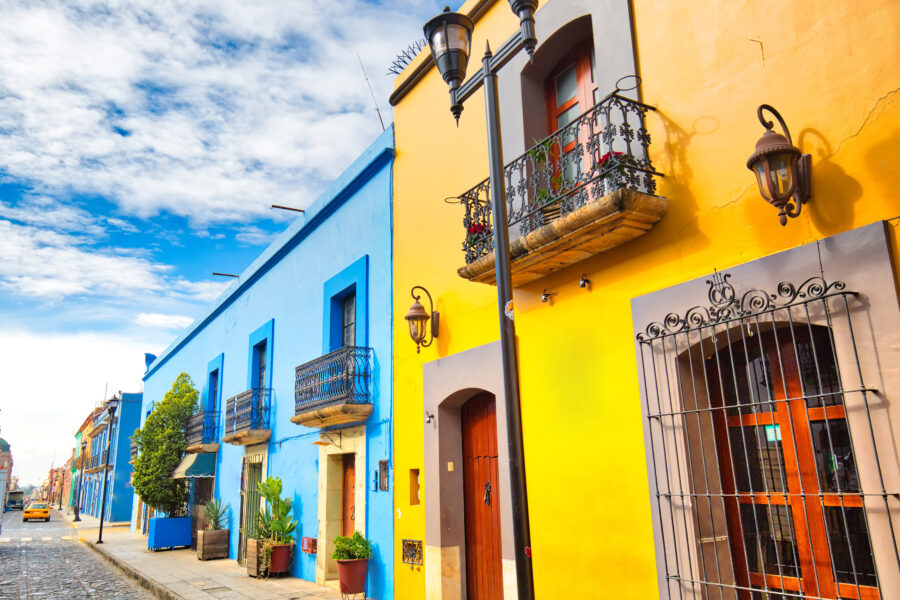 Scenic streets of Oaxaca city featuring vibrant colonial buildings in the historic city center.
