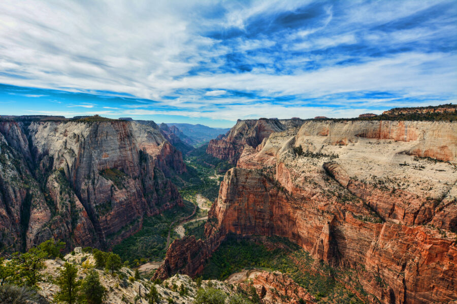 Panoramic landscape from Observation Point, featuring towering cliffs and vibrant greenery in Zion National Park
