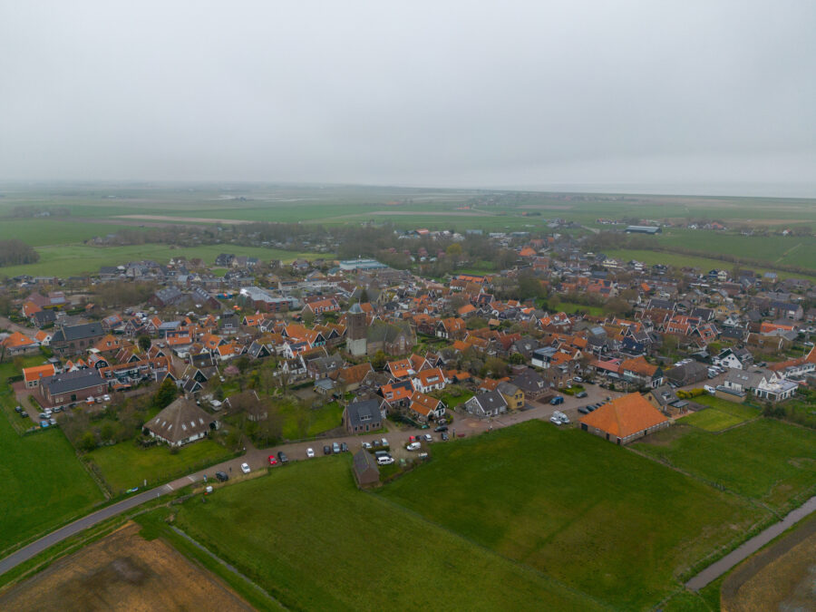 Aerial view of the small village Oosterend on Texel Island, surrounded by the Wadden Sea in the Netherlands.