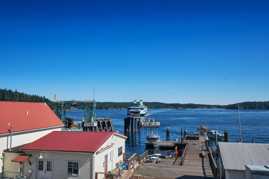 Washington State Ferry nearing the terminal on Orcas Island, surrounded by the scenic waters of the San Juan Islands.