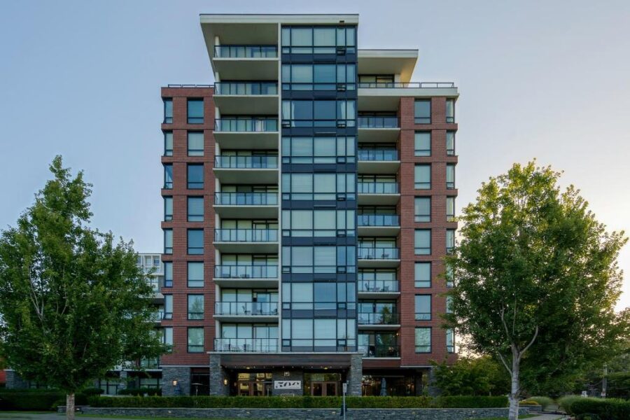 Oswego Hotel, a city apartment building in Victoria, BC, showcasing modern architecture amidst urban surroundings.