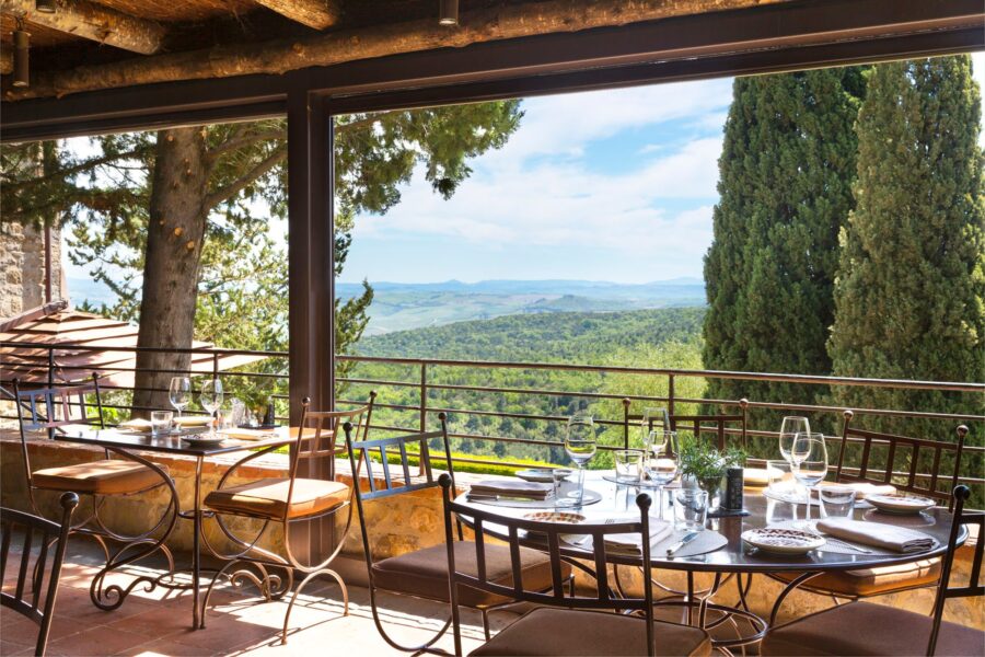 Outdoor dining with stunning landscape views, modern design, and elegant table settings.