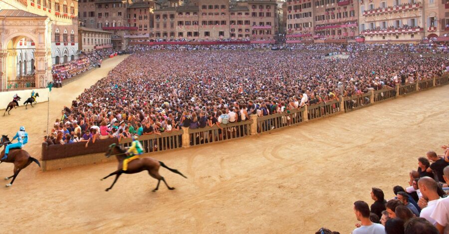 Palio di Siena horse race in packed historic Tuscan arena.