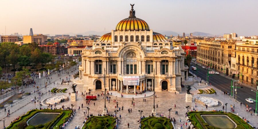 Palacio de Bellas Artes in Mexico City at sunset, showcasing stunning architecture and vibrant cultural ambiance.
