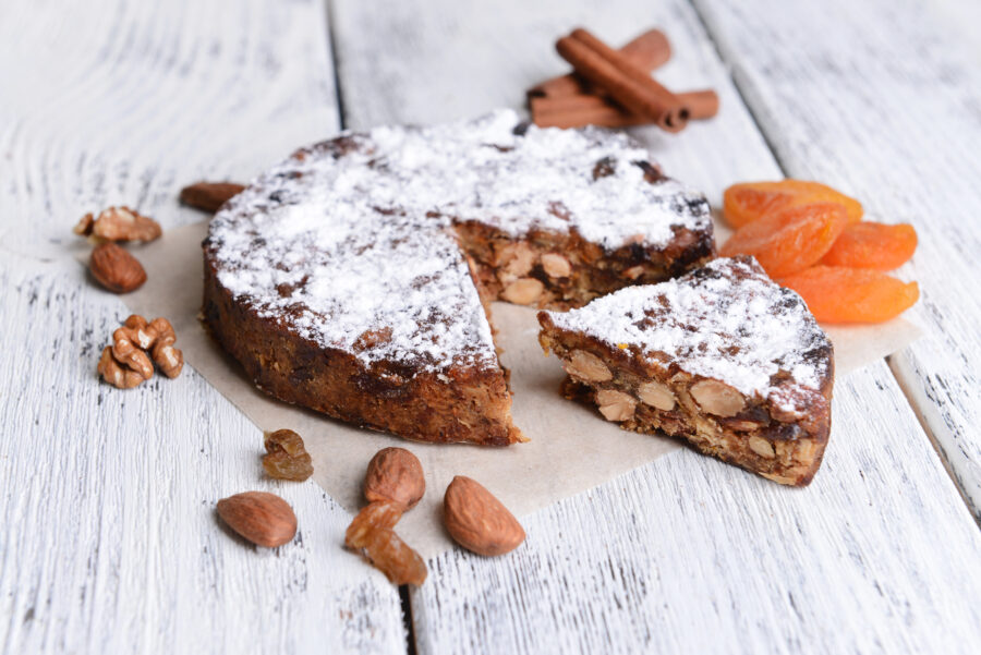 Close-up of a delicious panforte cake on a table, showcasing its rich texture and ingredients