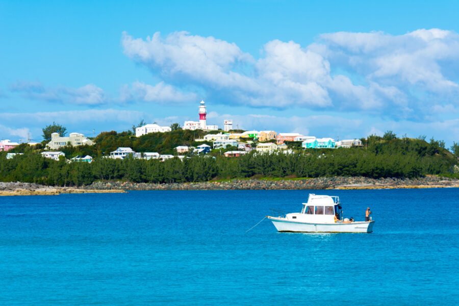Scenic panorama of Bermuda showcasing the skyline with boats on the water under a bright, sunny sky.