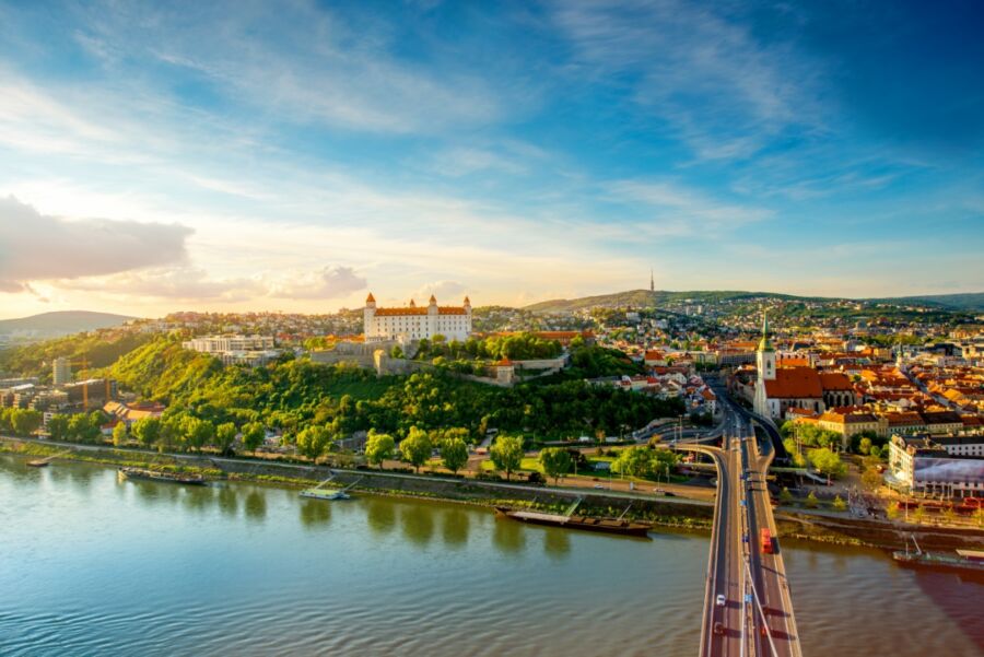 Aerial view of Bratislava's old town featuring Saint Martin's Cathedral, Castle Hill, and the Danube River