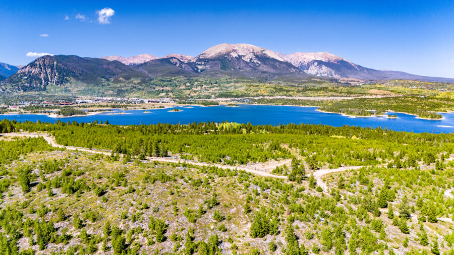 Summer panorama of Breckenridge, Colorado, captured from above, highlighting lush greenery and stunning mountain scenery
