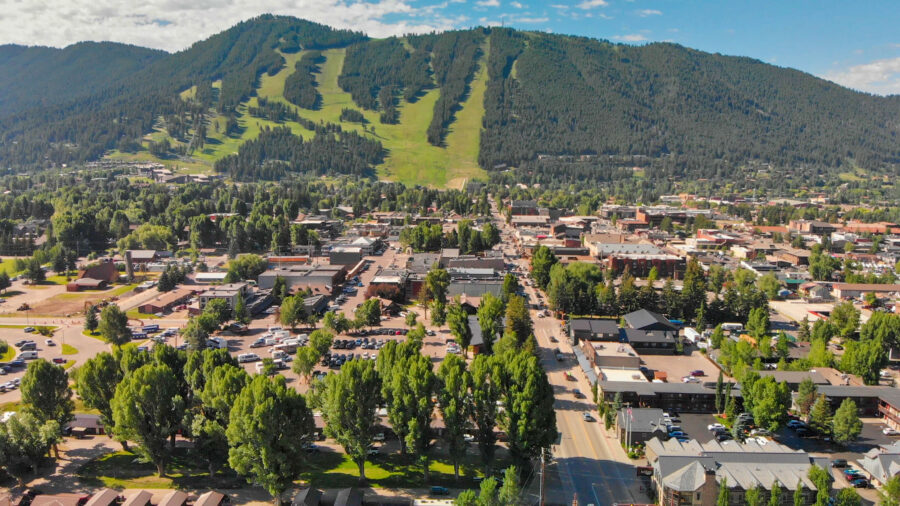 Aerial view of Jackson Hole, Wyoming, showcasing the town and surrounding landscape on a clear summer morning