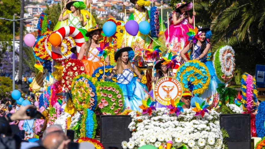 Colorful parade float with joyful performers, vibrant flowers, festive costumes, and excited onlookers.