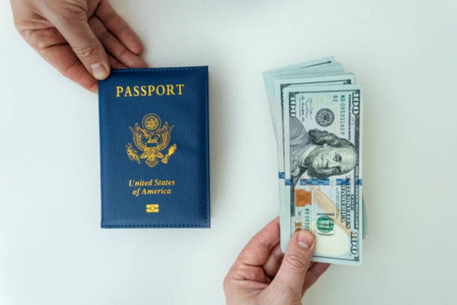 Passport and cash for travel preparation, symbolizing adventure and financial readiness.
