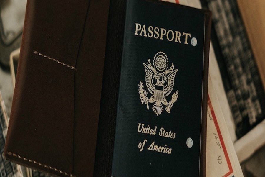 U.S. passport in brown leather holder, emphasizing travel, memory, and craftsmanship.
