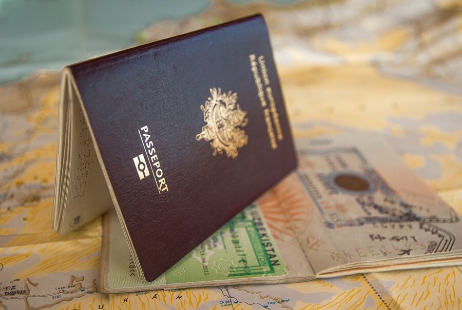 Passport and visa on map background, symbolizing travel, exploration, and adventure.