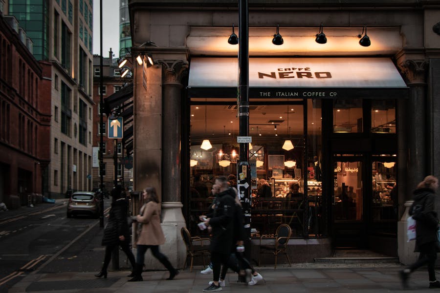 People Walking Outside a Coffee Shop