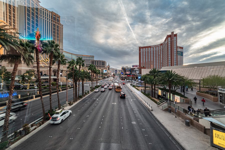 Vibrant Las Vegas Strip with Traffic and Palm Trees