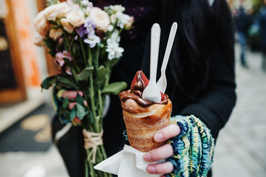 Close-up of Woman Holding Trdelník with Chocolate