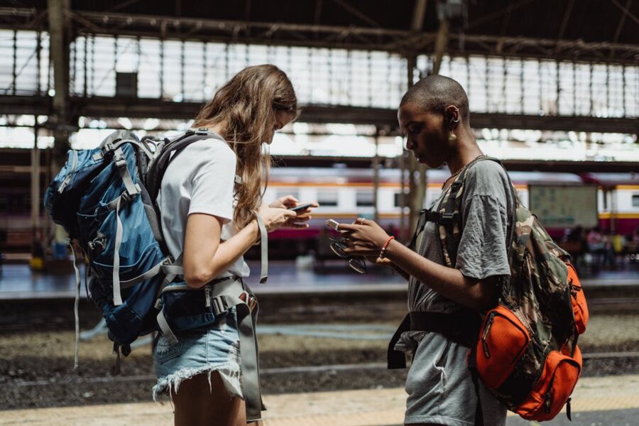 Women traveling busy with their Smartphones