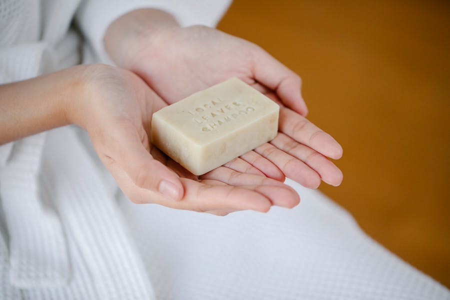 Woman holding natural shampoo bar