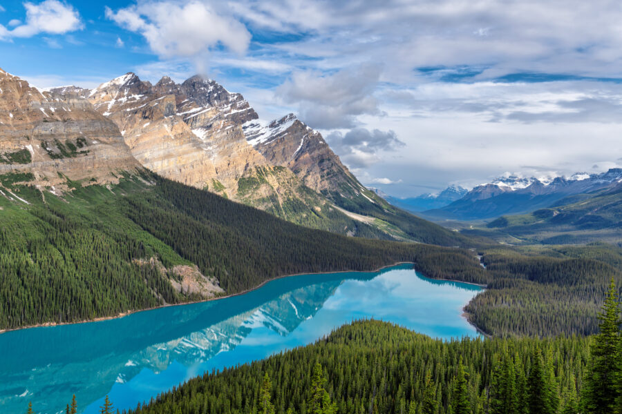 Scenic morning view of Peyto Lake in Banff National Park, highlighting its turquoise waters and the rugged mountains nearby.