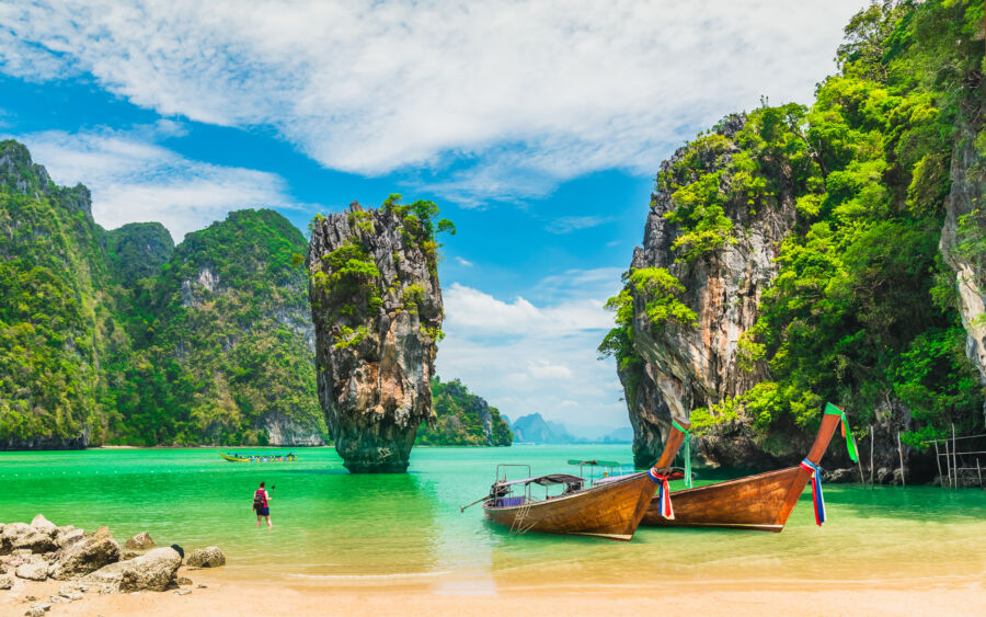 Scenic view of Phang-Nga Bay, a famous tourist attraction in Phuket, Thailand, featuring limestone cliffs and emerald waters