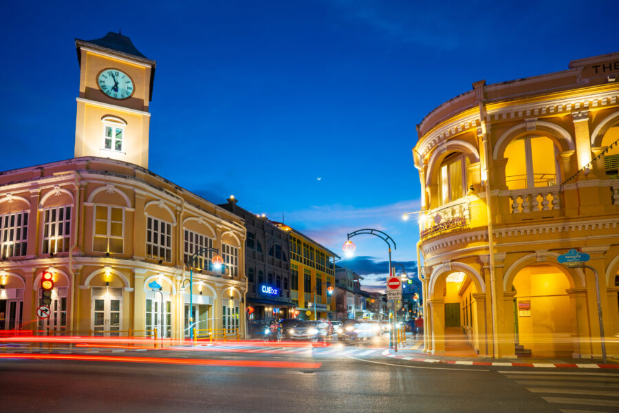 Night view of Phuket Old Town, showcasing vibrant lights illuminating historic buildings and streets