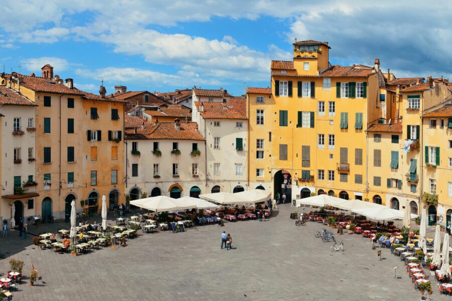 Aerial view of Piazza dell'Anfiteatro in Lucca, Italy, showcasing its unique shape and surrounding buildings
