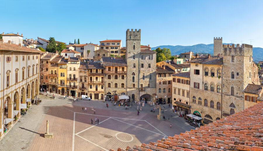 Panoramic aerial view of Piazza Grande square in Arezzo, highlighting its beautiful buildings and lively surroundings in Tuscany