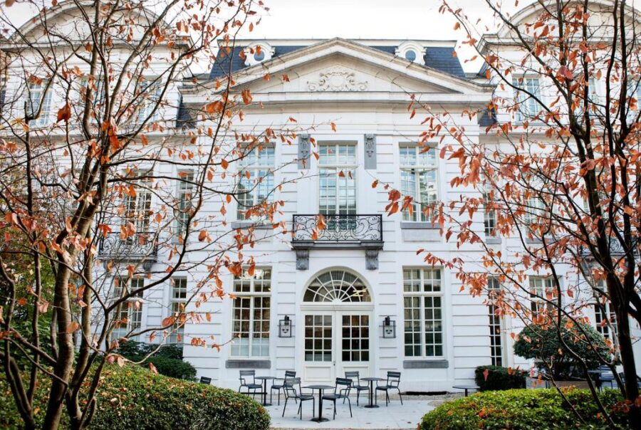 Pillows Grand Boutique Hotel Reylof Ghent, a white building with a large front porch, inviting and elegant in design.
