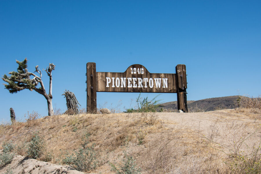 Sign for Pioneertown, a community in California's Morongo Basin, established by Hollywood investors for Western film production.