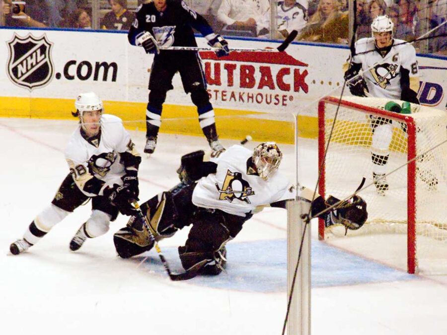The Pittsburgh Penguins team in action on the ice, displaying their skills and strategy during a competitive game.

