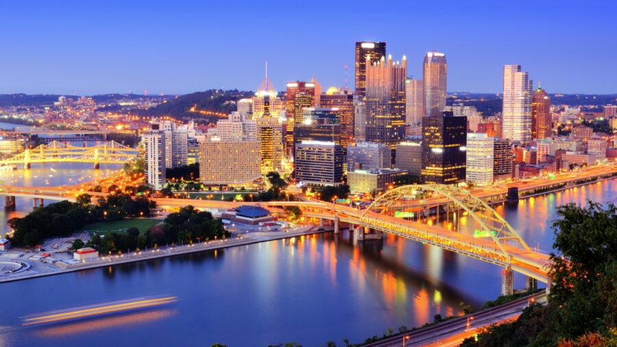 Aerial view of Pittsburgh, Pennsylvania, showcasing the city skyline with its iconic buildings and rivers.