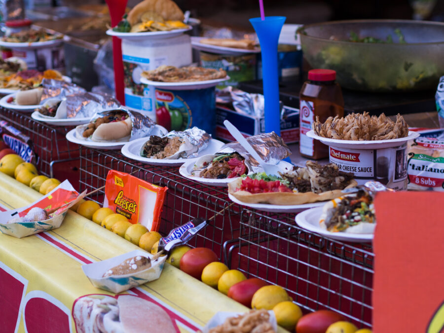 Colorful street food vendors in Pittsburgh, featuring a variety of local and international culinary delights
