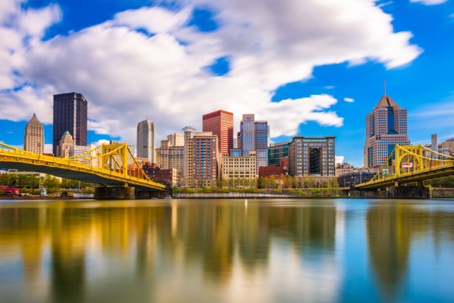 Skyline panorama of Pittsburgh, Pennsylvania, featuring tall buildings and the rivers that define the city’s landscape