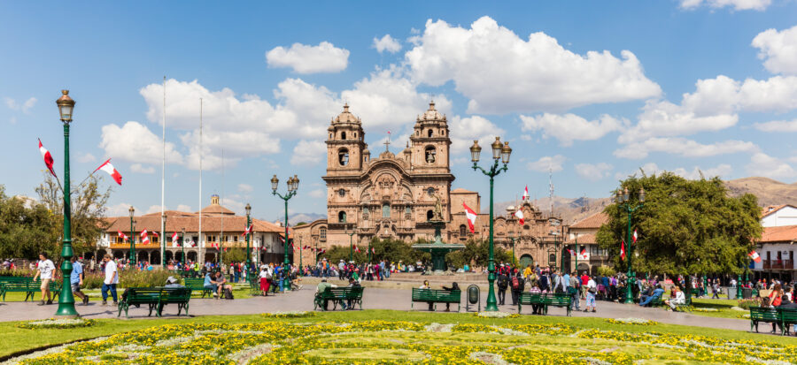Panoramic view of Plaza de Armas in Cusco, Peru, showcasing historic architecture and vibrant public spaces.
