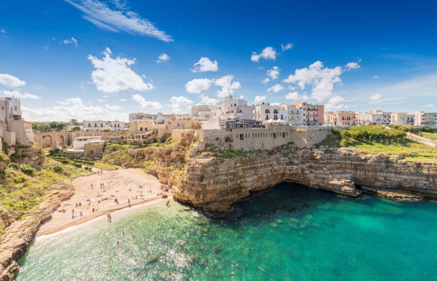 Aerial view of Polignano A Mare, showcasing its stunning coastline and charming skyline in Puglia, Italy