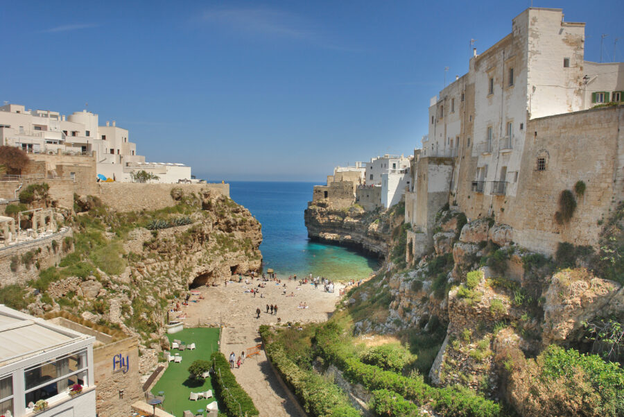 Aerial view of Polignano a Mare, a charming town in Apulia, known for its stunning cliffs and Mediterranean coastline.