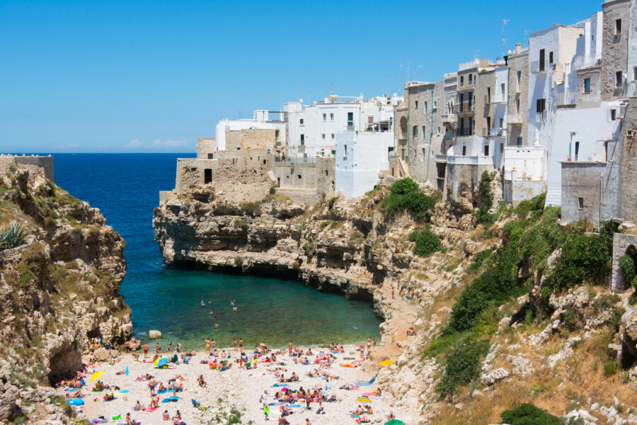 Scenic view of Polignano a Mare, a picturesque town perched on rocky cliffs in Apulia, Italy.
