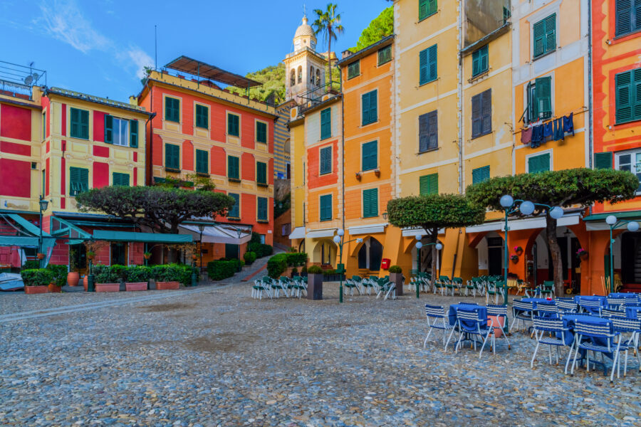 Scenic view of Portofino's city center, showcasing its charming coastal architecture and lively harbor in Liguria, Italy